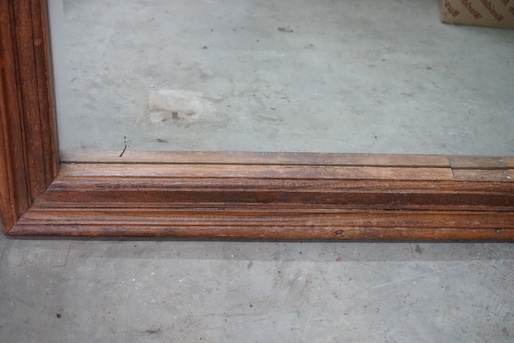 A provincial rectangular fruitwood bevelled wall mirror, width 90cm, height 152cm